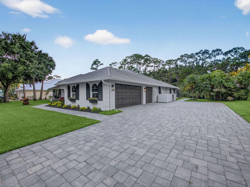 Photo of 8025 SW Yachtsmans Drive, Stuart, FL 34997 (MLS # RX-11127900)