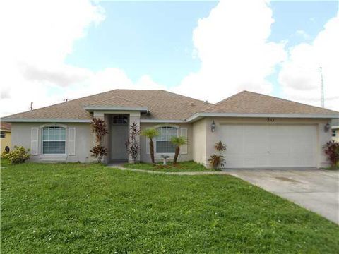 Photo of 2112 SW Burlington Street, Port Saint Lucie, FL 34984 (MLS # RX-11129021)