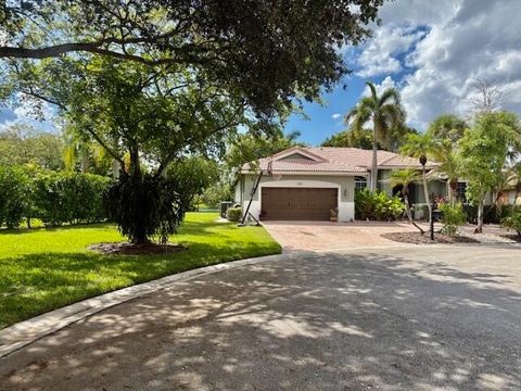 Photo of 302 NW 120th Drive Drive, Coral Springs, FL 33071 (MLS # RX-11119404)
