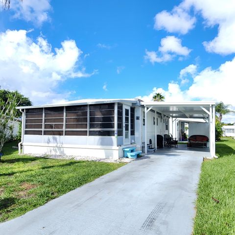 Photo of 15 Indigo Lane, Port Saint Lucie, FL 34952 (MLS # RX-11125501)