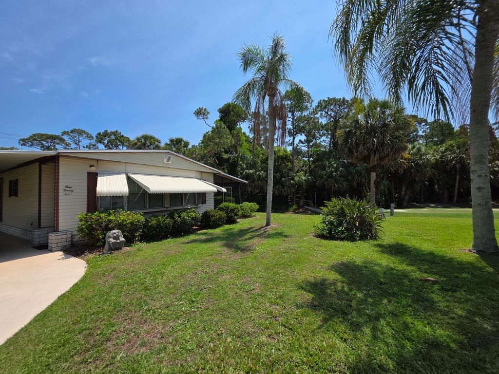 Photo of 124 W Caribbean, Port Saint Lucie, FL 34952 (MLS # RX-11093928)