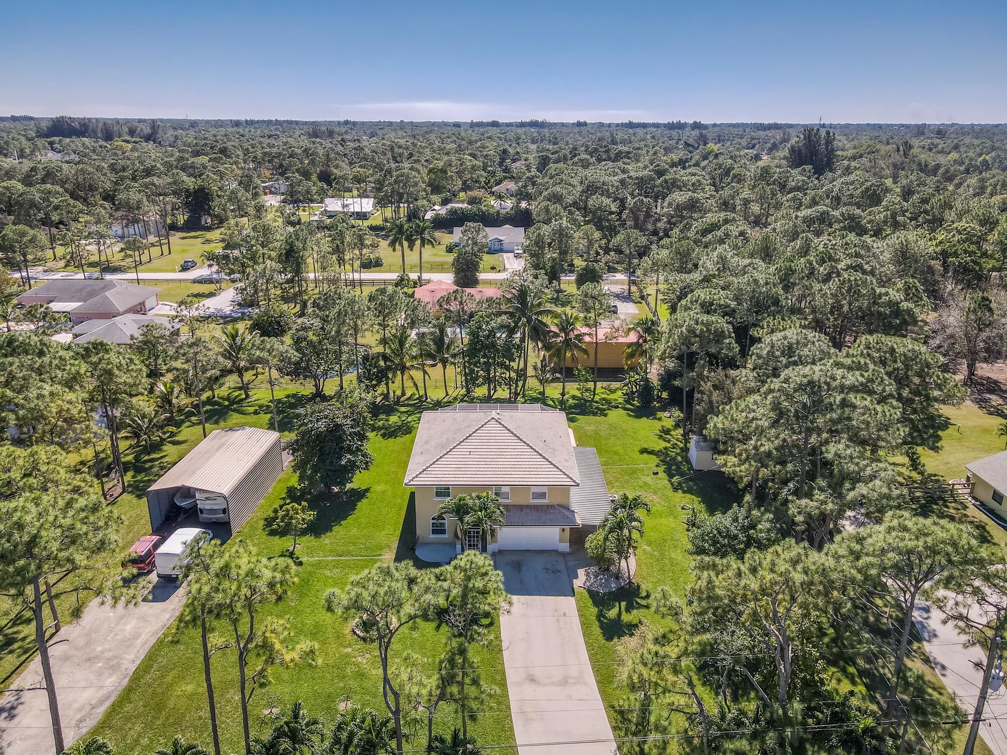 Property for Sale at 13714 Key Lime Boulevard, The Acreage, Palm Beach County, Florida - Bedrooms: 5 
Bathrooms: 2.5  - $1,079,970