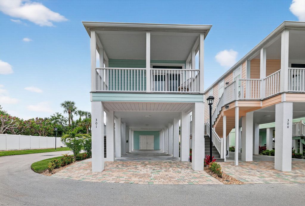 Photo of 301 NE Coastal Drive, Jensen Beach, FL 34957 (MLS # RX-11124042)