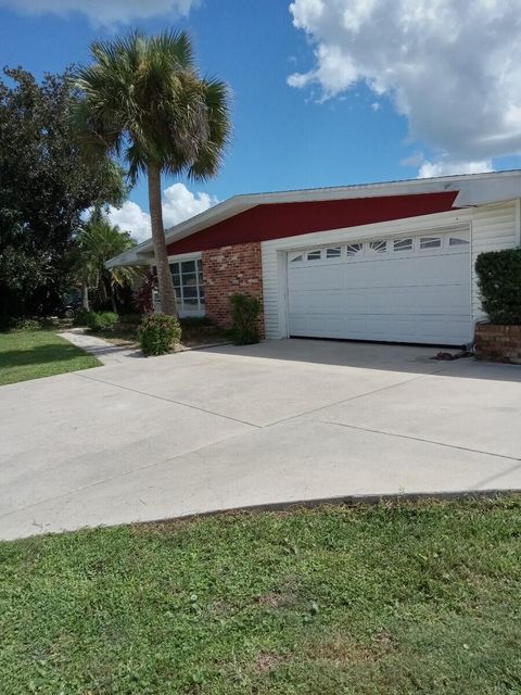 Photo of 406 Leeland Heights Boulevard E, Lehigh Acres, FL 33936 (MLS # RX-11125471)