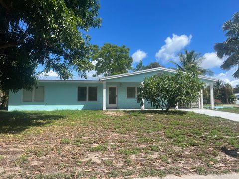 Photo of 1395 NE Flora Place, Jensen Beach, FL 34957 (MLS # RX-11120468)