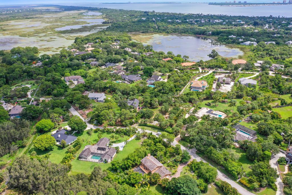 Photo of 880 NE Stokes Terrace, Jensen Beach, FL 34957 (MLS # RX-11094580)