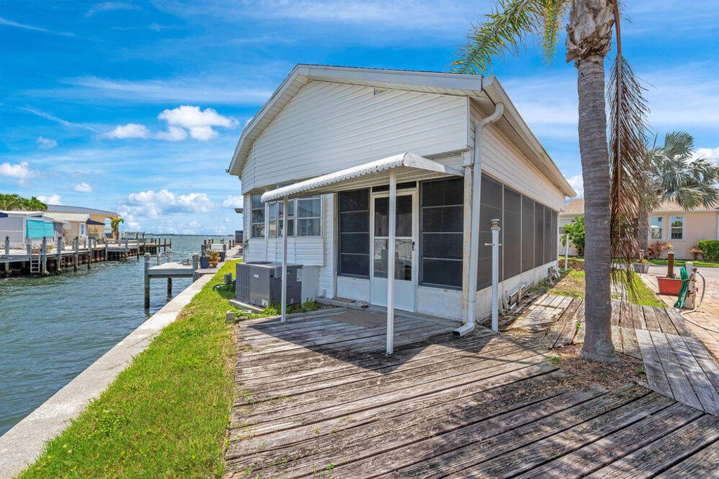 Photo of 1135 Nettles Boulevard, Jensen Beach, FL 34957 (MLS # RX-11099327)