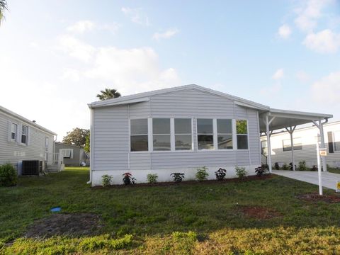 Photo of 480 Pelican Shoal Place, Fort Pierce, FL 34982 (MLS # RX-11125029)