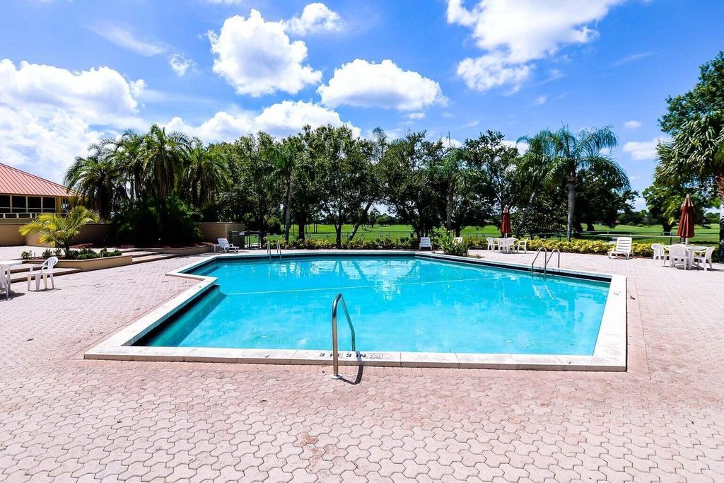 Photo of 9440 Meadowood Drive #102, Fort Pierce, FL 34951 (MLS # RX-11092632)