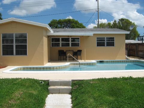 Photo of 1023 Andrews Road, West Palm Beach, FL 33405 (MLS # RX-11127661)