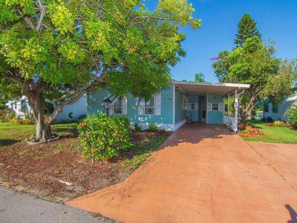 Photo of 6910 SE Morningside Drive, Stuart, FL 34997 (MLS # RX-11110143)