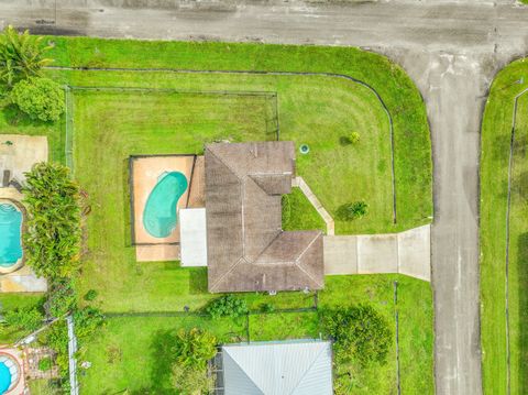 Photo of 3789 SW Haines Street Street, Port Saint Lucie, FL 34953 (MLS # RX-11129527)