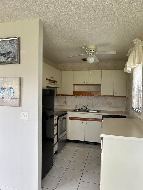 Photo of 21 Lake Vista Trail #105, Port Saint Lucie, FL 34952 (MLS # RX-11129077)