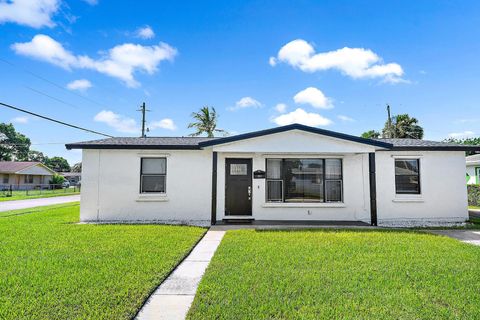 Photo of 1301 W 26th Street, Riviera Beach, FL 33404 (MLS # RX-11129737)