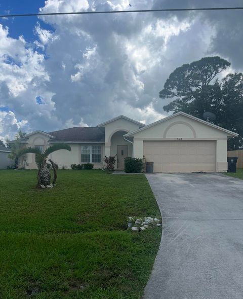 Photo of 302 SW Carter Avenue, Port Saint Lucie, FL 34983 (MLS # RX-11128959)