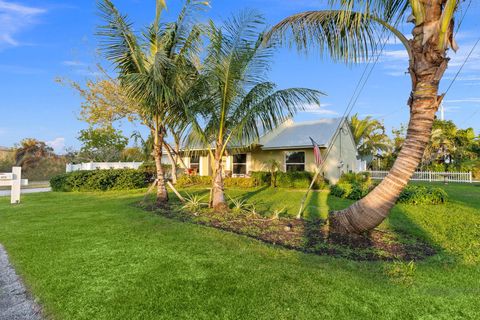 Photo of 2070 NE Arch Street, Jensen Beach, FL 34957 (MLS # RX-11092449)