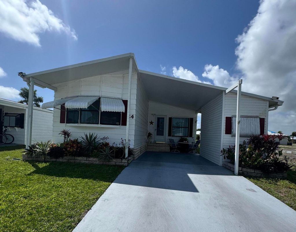 Photo of 24 Villa Del Norte, Fort Pierce, FL 34951 (MLS # RX-11083899)