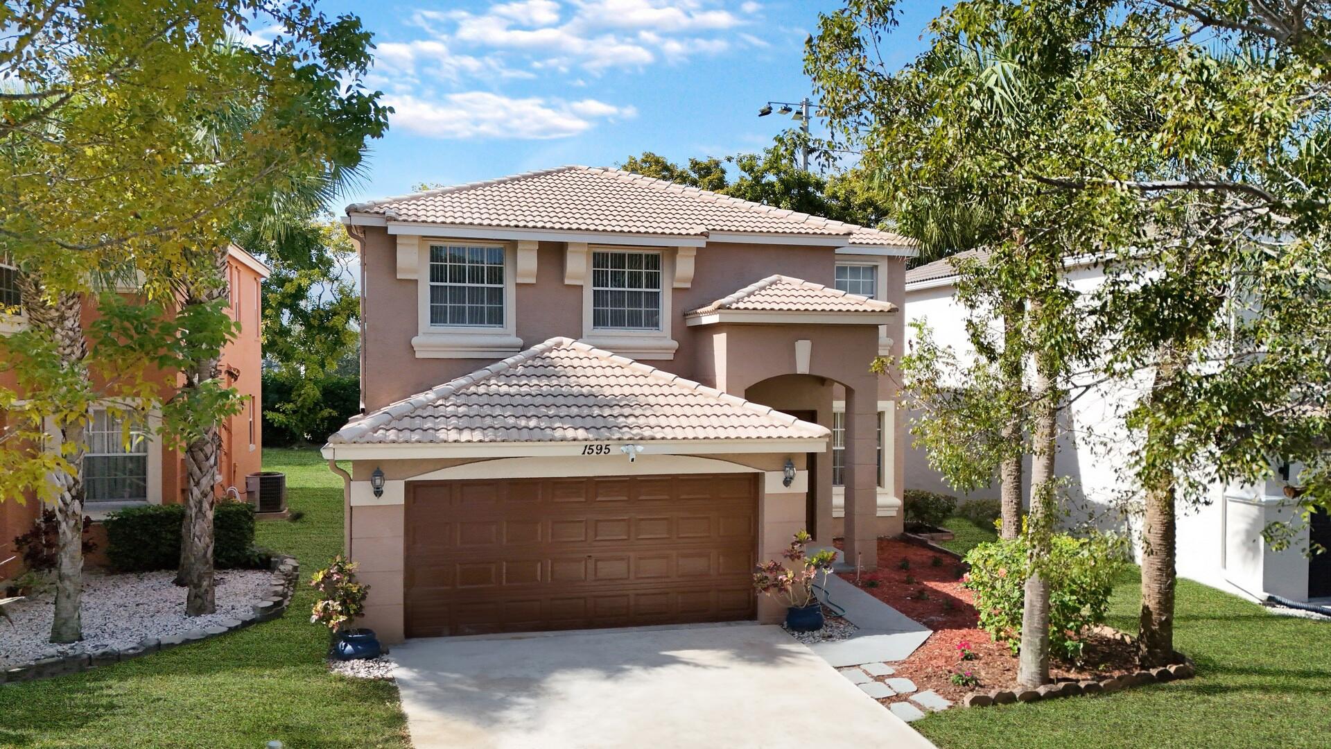 Property for Sale at 1595 Briar Oak Drive, Royal Palm Beach, Palm Beach County, Florida - Bedrooms: 4 
Bathrooms: 2.5  - $579,000