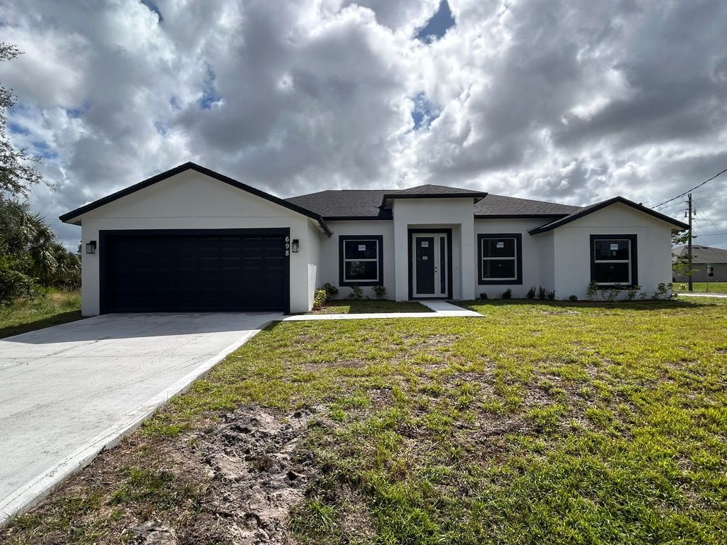 Photo of 698 Mexia Street SW, Palm Bay, FL 32908 (MLS # RX-11119431)