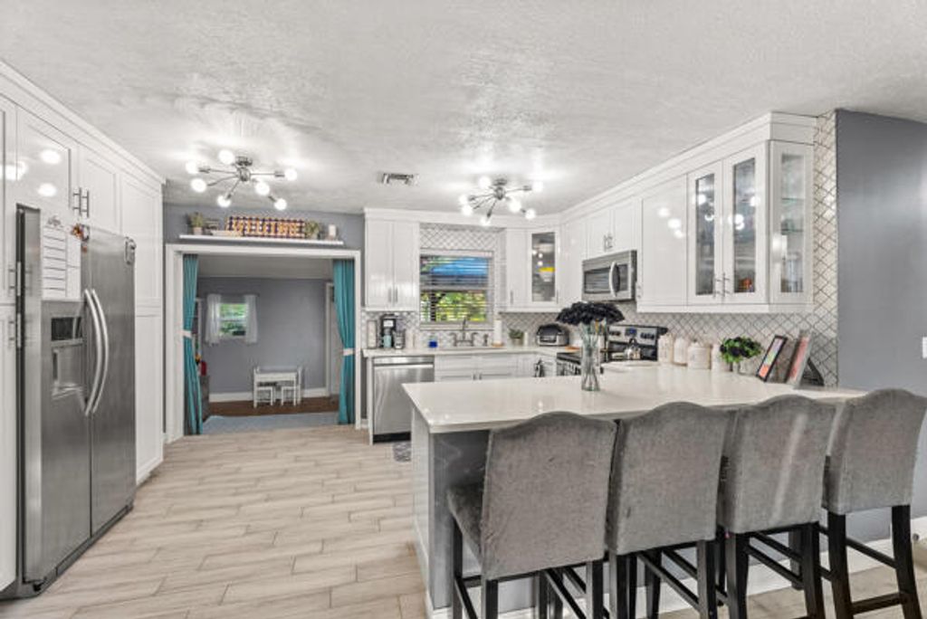 Photo of 5865 SE Rosemont Avenue E, Stuart, FL 34997 (MLS # RX-11062119)