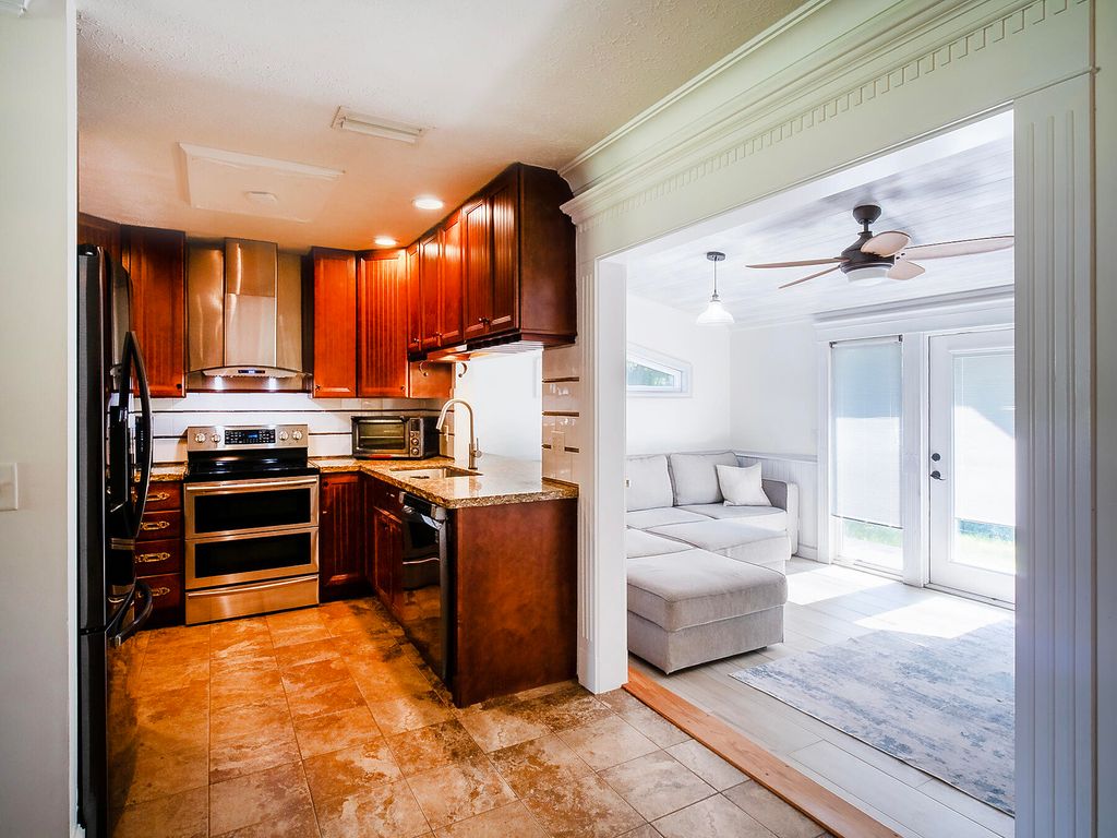 Photo of 446 SE Cardinal Trail, Stuart, FL 34997 (MLS # RX-11075812)