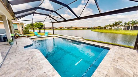 Photo of 10250 SW Coral Tree Circle, Port Saint Lucie, FL 34987 (MLS # RX-11129108)