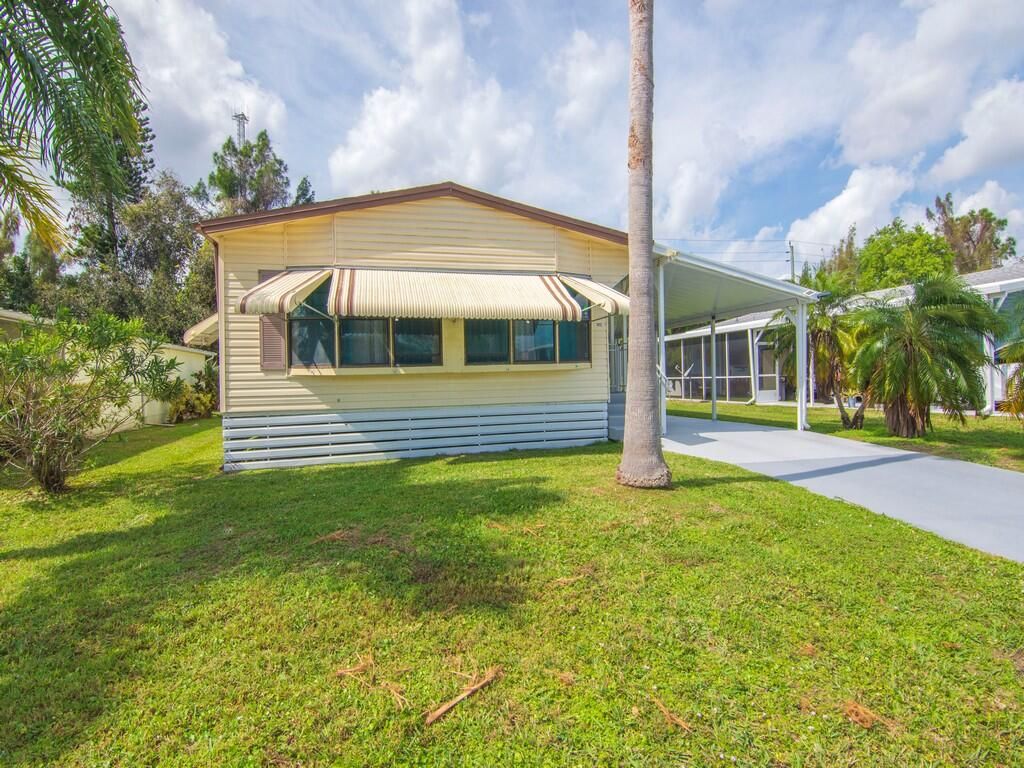 Photo of 212 W Caribbean, Port Saint Lucie, FL 34952 (MLS # RX-11112359)