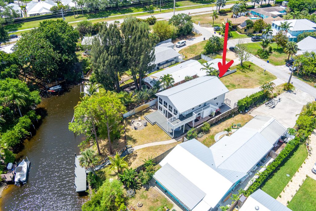 Photo of 1447 SW Peninsula Lane, Palm City, FL 34990 (MLS # RX-11083916)