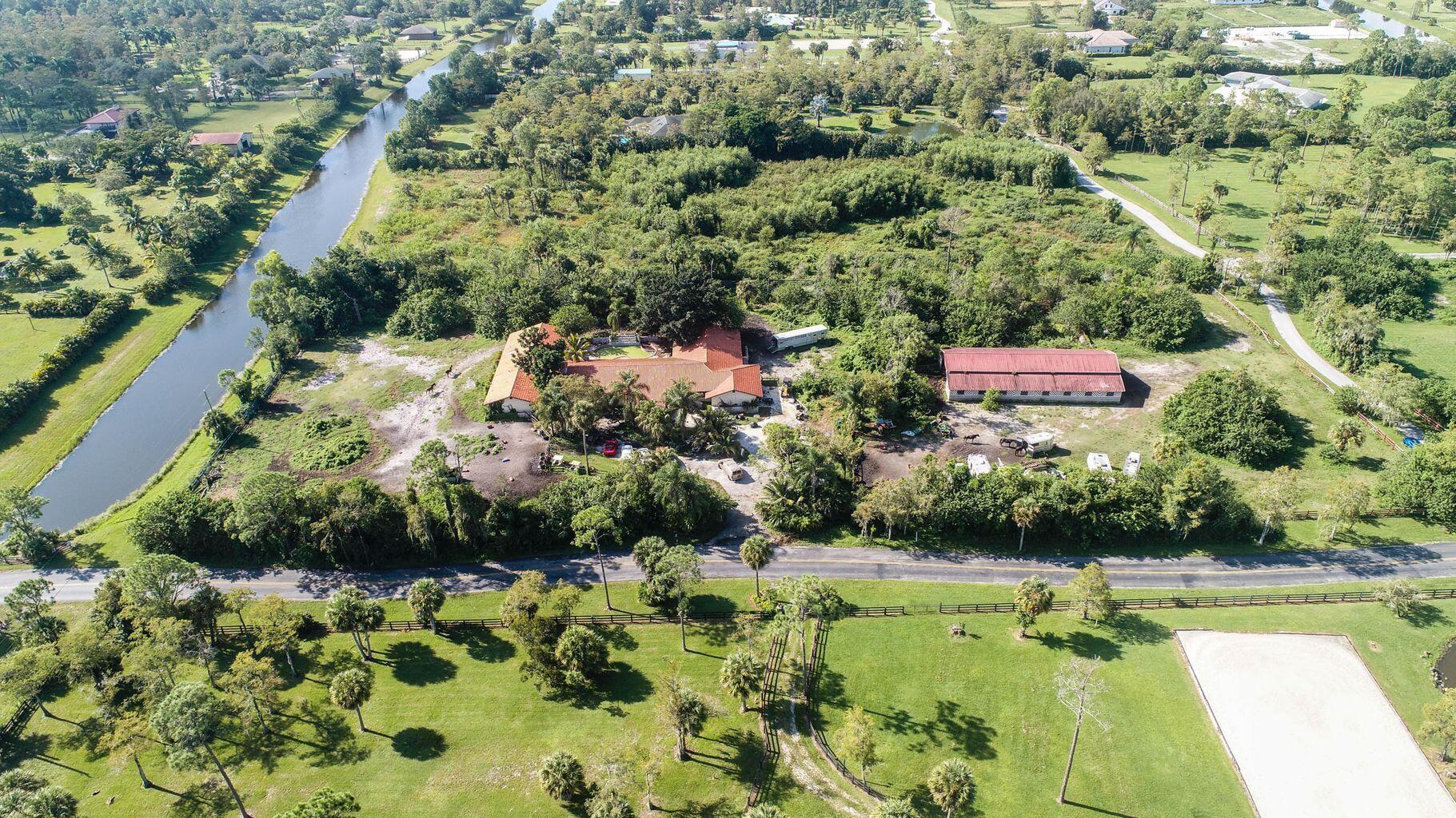 Property for Sale at 2438 Palm Deer Drive, Loxahatchee, Palm Beach County, Florida - Bedrooms: 6 
Bathrooms: 5.5  - $1,250,000