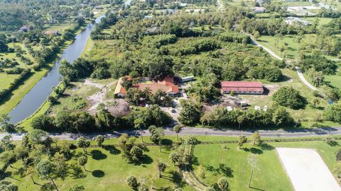 Photo of 2438 Palm Deer Drive, Loxahatchee, FL 33470 (MLS # RX-10902356)