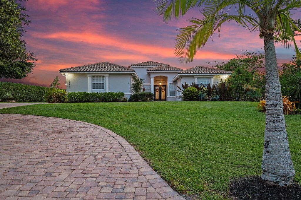 Photo of 1936 SW Wood Duck Lane, Palm City, FL 34990 (MLS # RX-11093114)