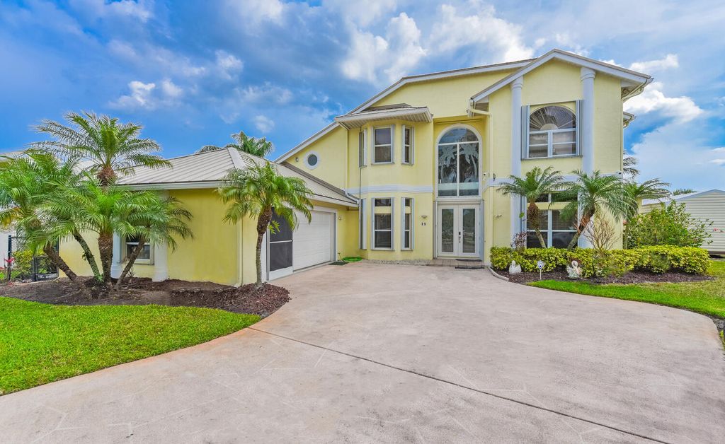 Photo of 710 SE Essex Drive, Port Saint Lucie, FL 34984 (MLS # RX-11114036)