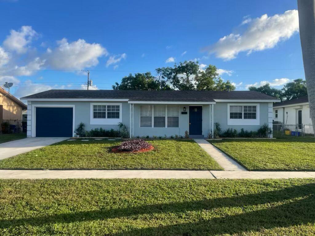 218 Baker Drive, West Palm Beach, Palm Beach County, Florida - 4 Bedrooms  
2 Bathrooms - 