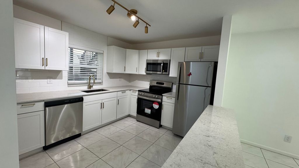 Photo of 6531 SE Federal Highway #J104, Stuart, FL 34997 (MLS # RX-11115402)