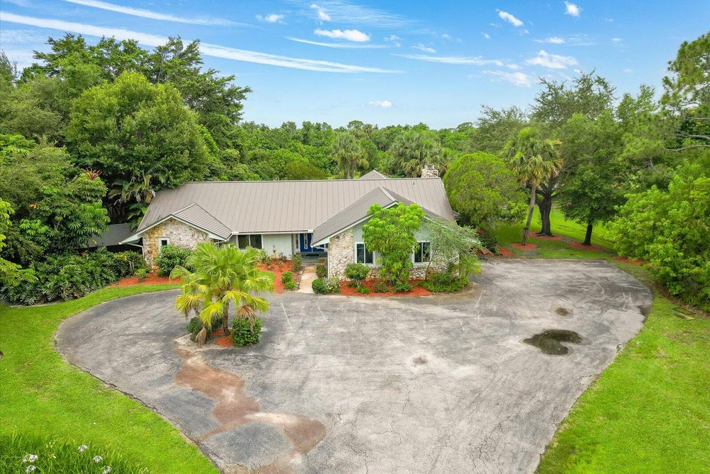 Photo of 1614 SW Saint Andrews Drive, Palm City, FL 34990 (MLS # RX-11088564)