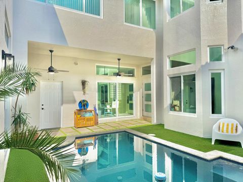 Photo of 1087 Satinleaf Street, Hollywood, FL 33019 (MLS # RX-11123161)