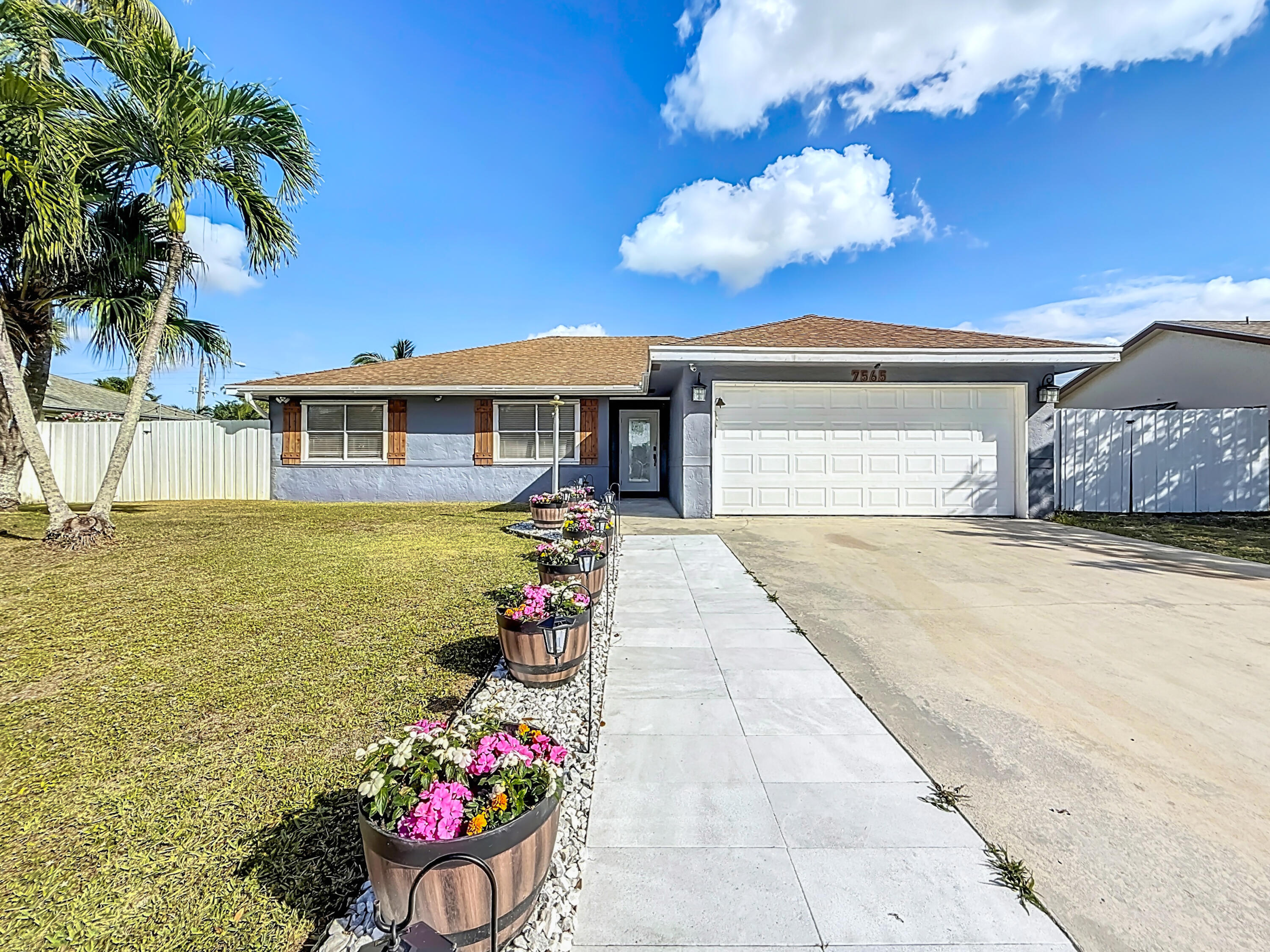 Property for Sale at 7565 Woodland Creek Lane, Lake Worth, Palm Beach County, Florida - Bedrooms: 3 
Bathrooms: 2  - $547,900