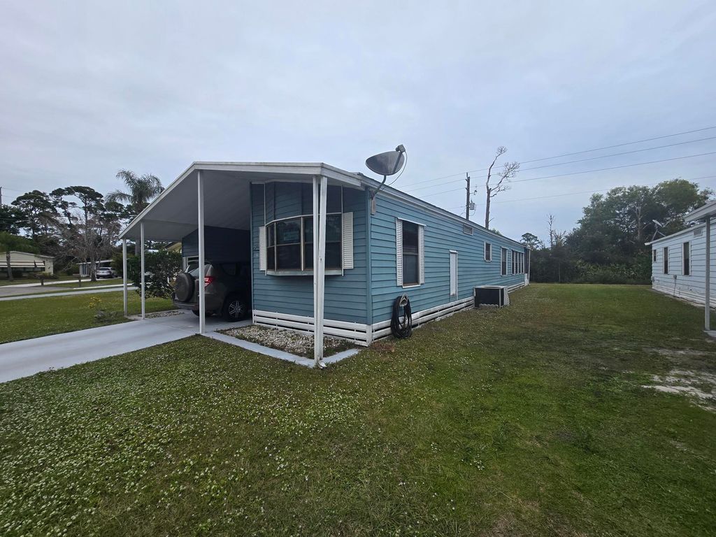 Photo of 47 Flores Del Norte, Fort Pierce, FL 34951 (MLS # RX-11053588)