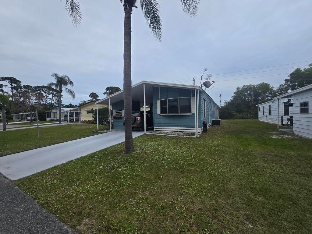 Photo of 47 Flores Del Norte, Fort Pierce, FL 34951 (MLS # RX-11053588)