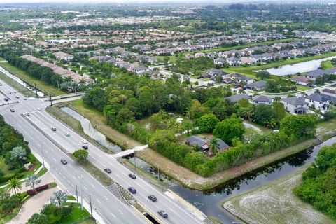 Photo of 5947 Hypoluxo Road, Lake Worth, FL 33463 (MLS # RX-11095222)