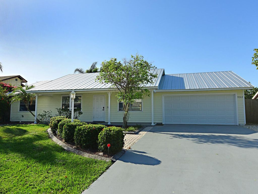 Photo of 598 NE Maranta Terrado, Jensen Beach, FL 34957 (MLS # RX-10956955)
