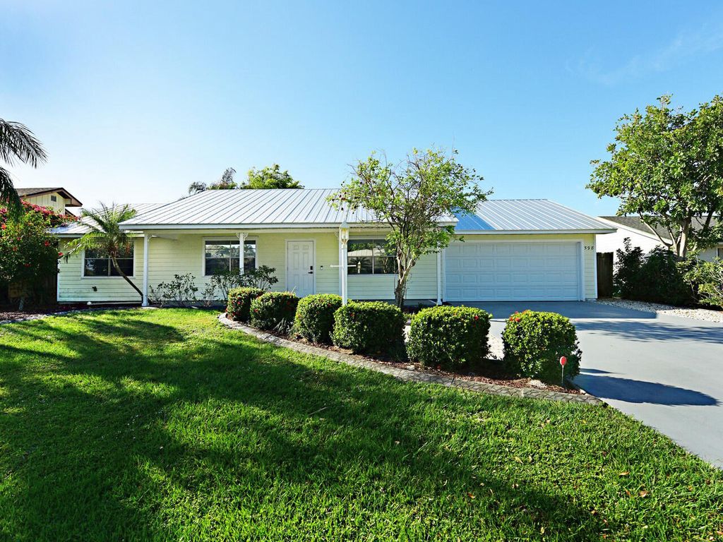 Photo of 598 NE Maranta Terrado, Jensen Beach, FL 34957 (MLS # RX-10956955)