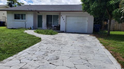 Photo of 6541 NW 33 Way, Fort Lauderdale, FL 33309 (MLS # RX-11117962)