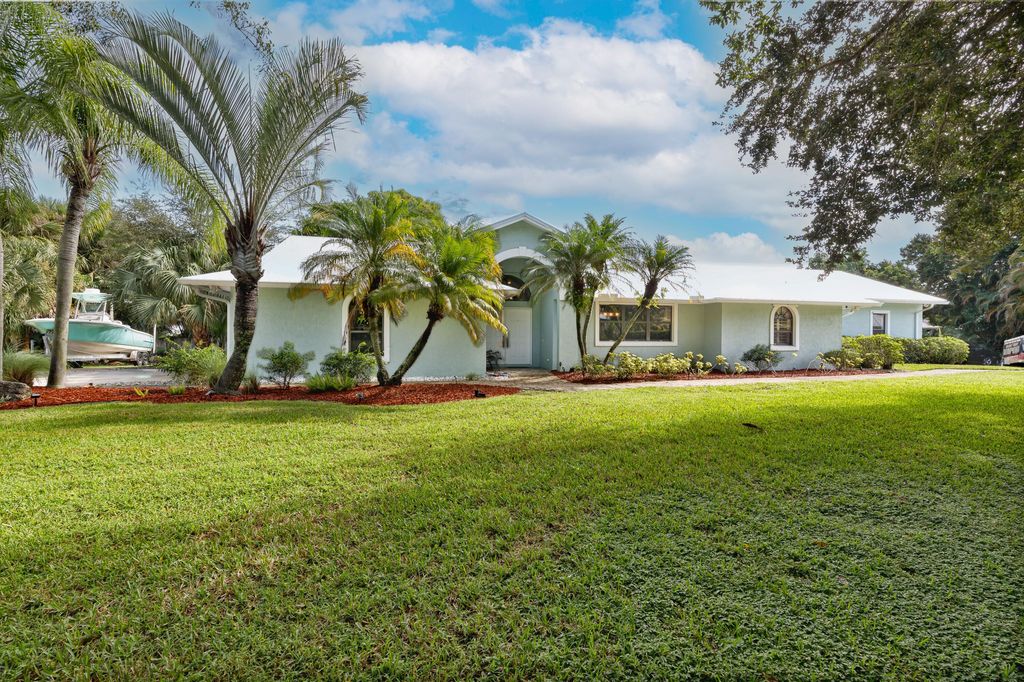 Photo of 1225 SW Magnolia Bluff Drive, Palm City, FL 34990 (MLS # RX-11128271)