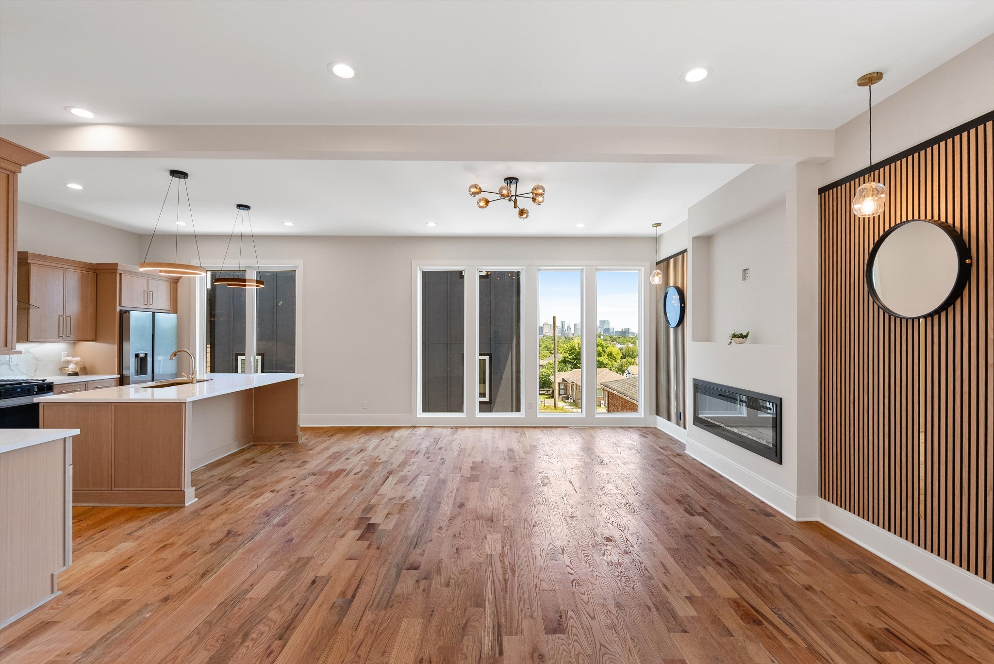 Wide 3 story with living, kitchen and primary bed on 2nd level