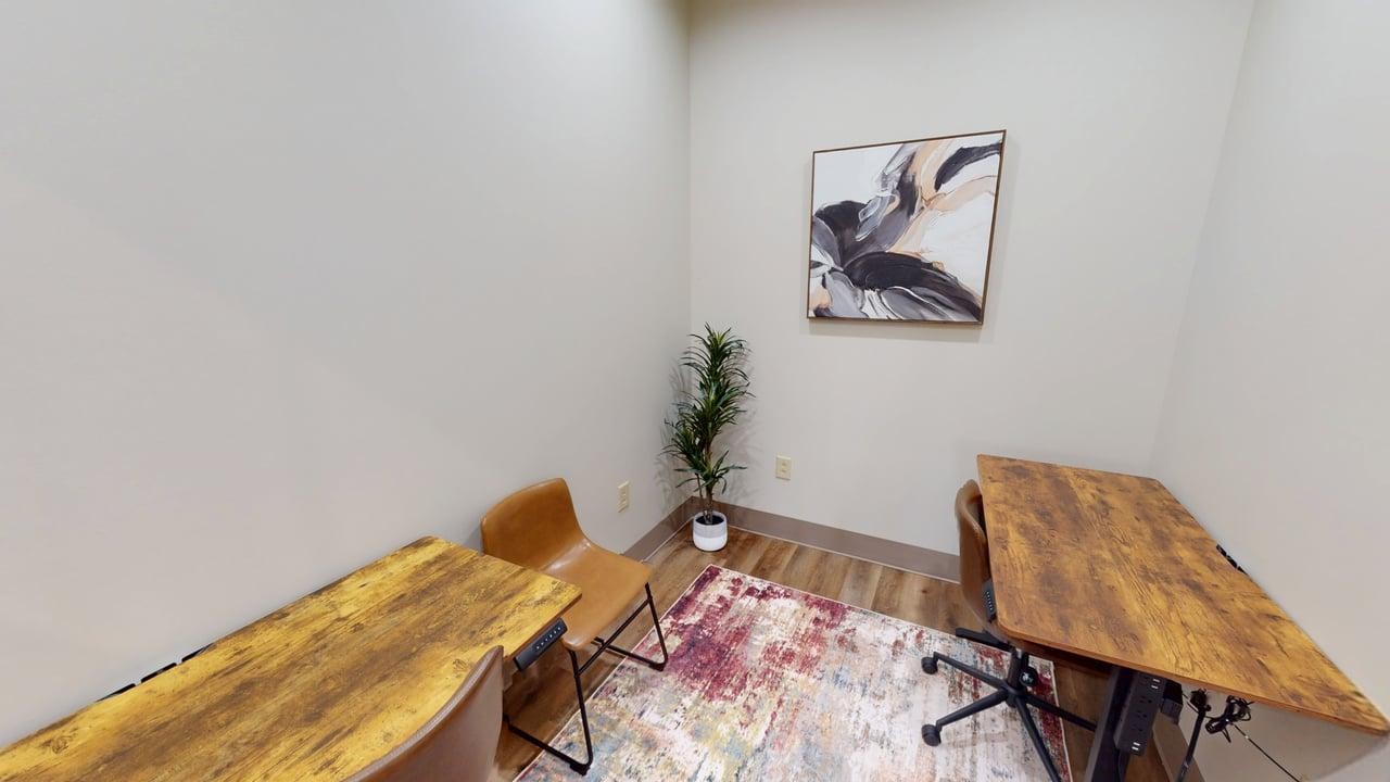 Semi-private workspace featuring a dedicated two-person desk area?ideal for small teams, partners, or professionals needing a quiet, collaborative setting. Includes comfortable seating, ample workspace, and convenient access to shared amenities.