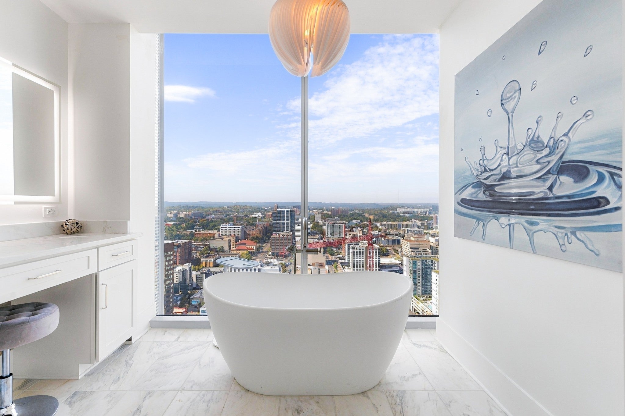 2-bed condo for sale in Nashville, TN 37203, 1616 West End Ave 3001 Bathroom with a freestanding soaking tub in front of a floor-to-ceiling window with a city view