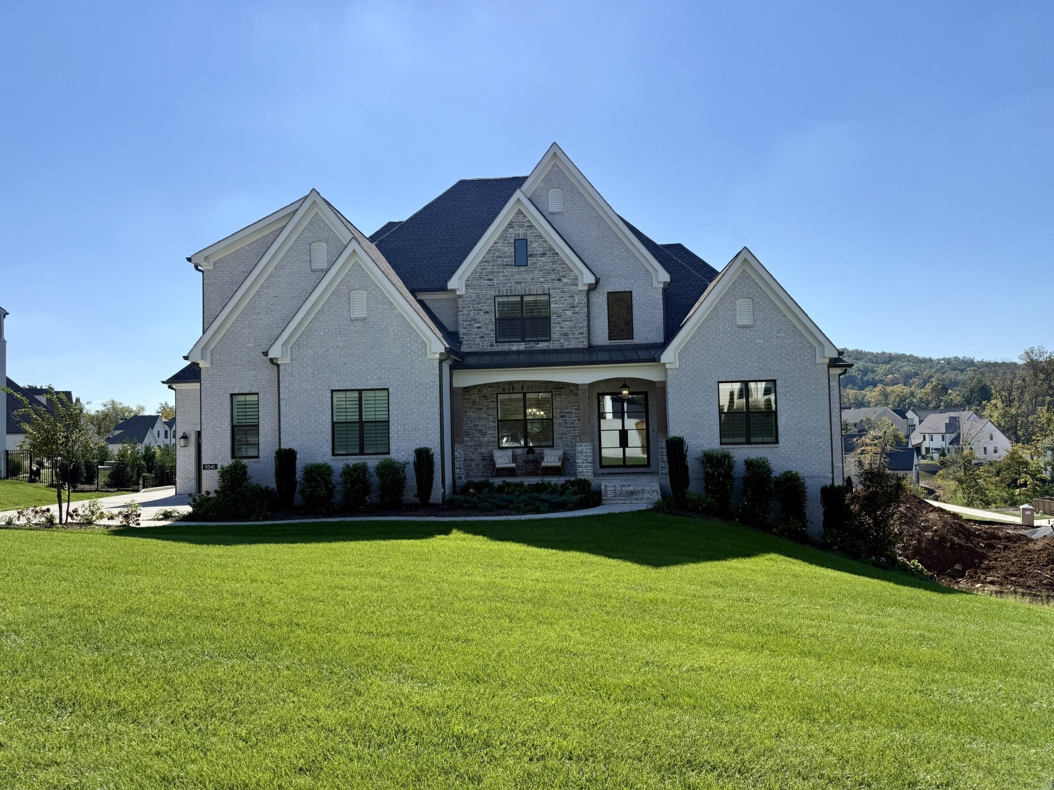 5-bed home for sale in Brentwood, TN 37027, 9541 Tarren Mill Ln Three-story brick home at 9541 Tarren Mill Ln, Brentwood, TN 37027, with a gabled roofline, white trim and a covered front entry