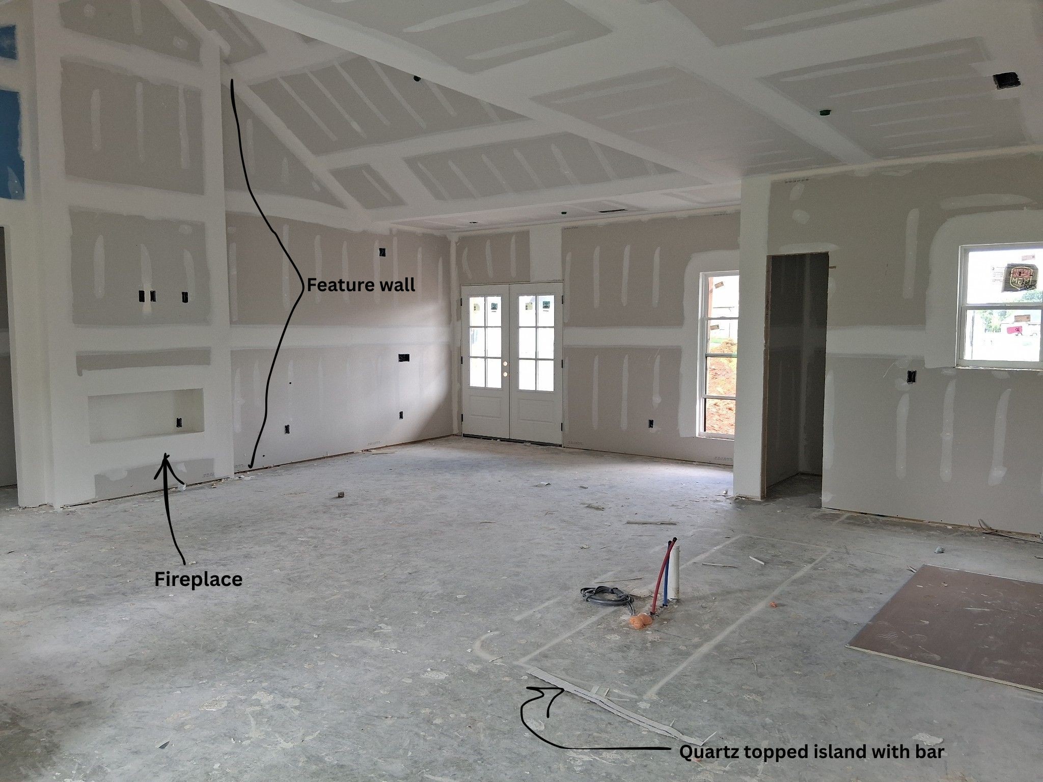 Photo from previous build of the Modern Farmhouse plan. To the right, the barn door leads to the pantry.