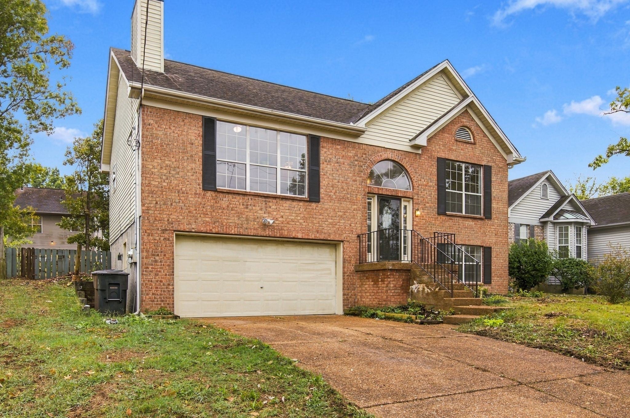 3-bed home for sale in Antioch, TN 37013, 1109 Burlingame Ct Brick home with a two-car garage door, a front walkway and dark shutters on the upper windows